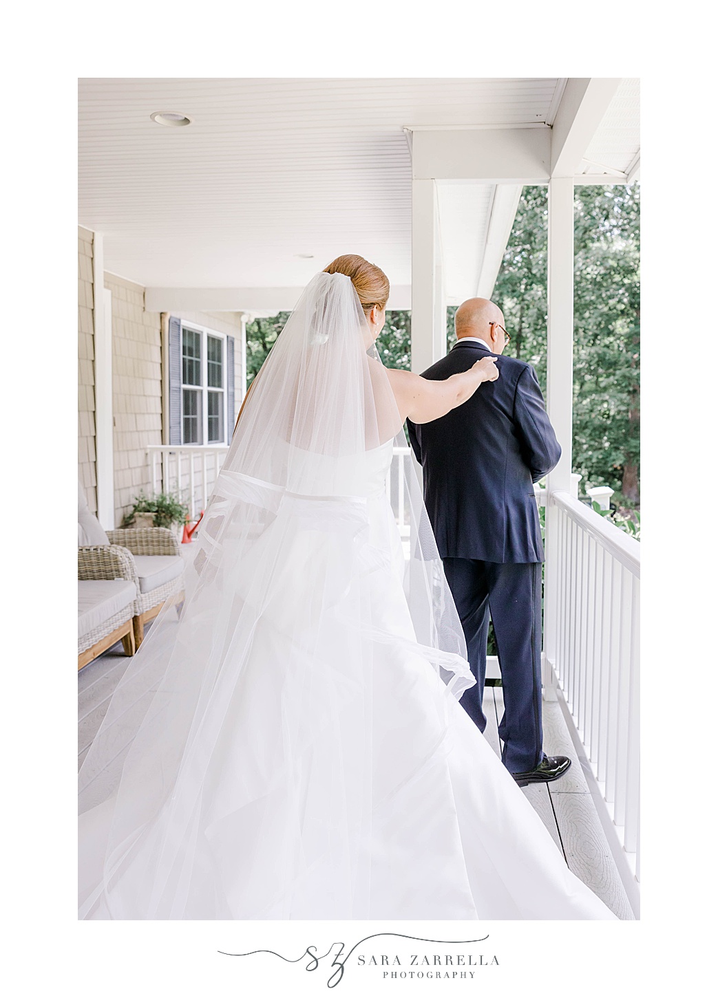 bride approaches dad for first look on front porch