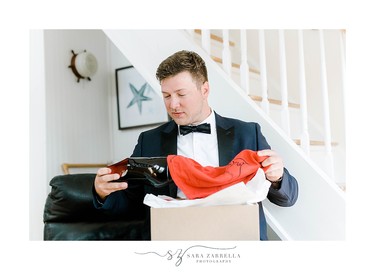 groom opens present on wedding morning from bride