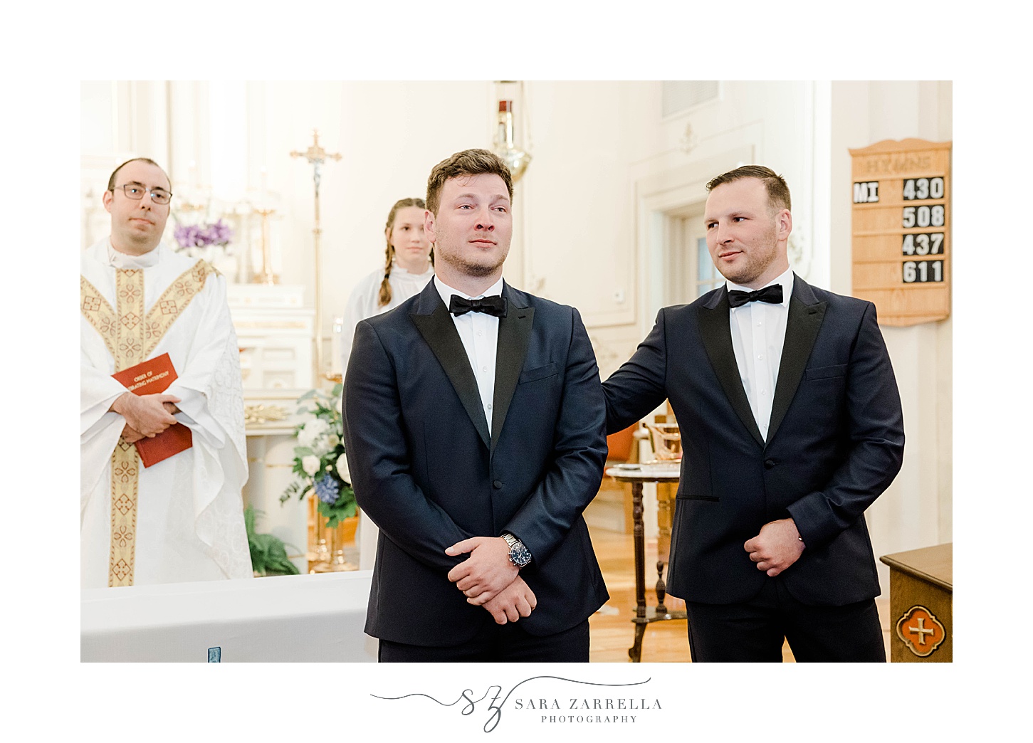 groom chokes up watching bride enter traditional church wedding in Rhode Island
