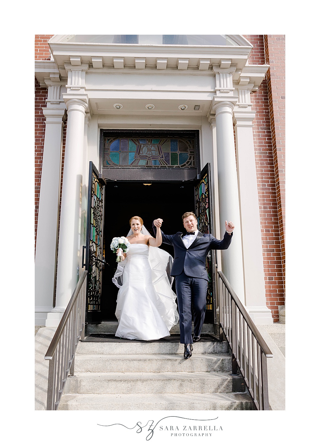 newlyweds cheer leaving church after traditional church wedding in Rhode Island