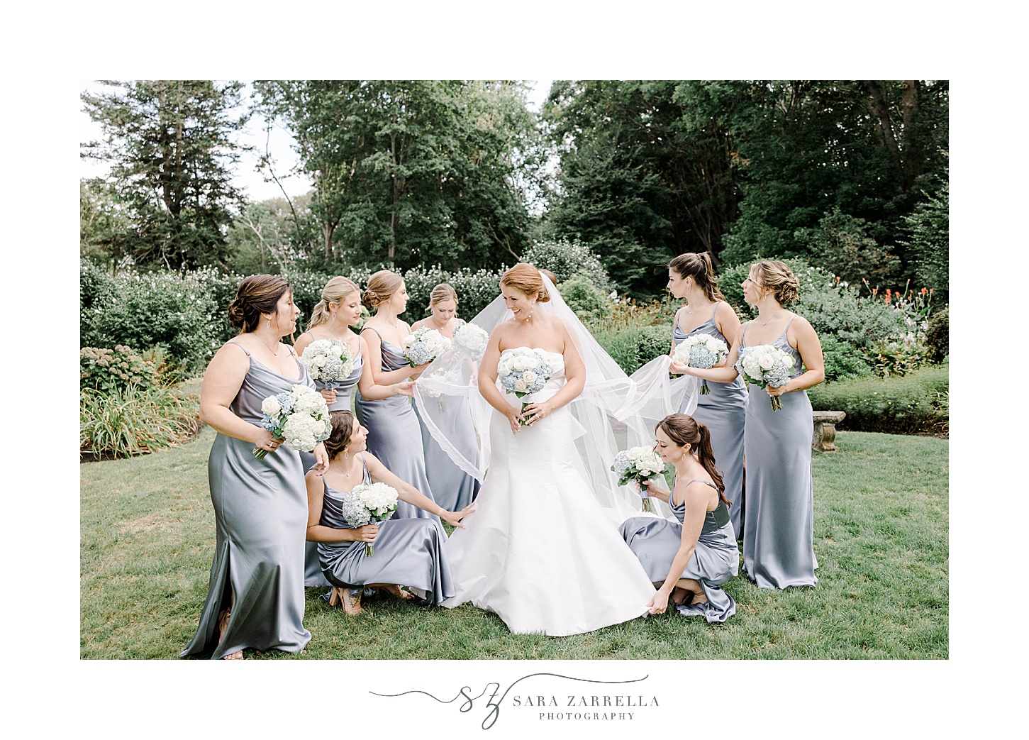bride and bridesmaids smile together in gardens at Glen Manor House