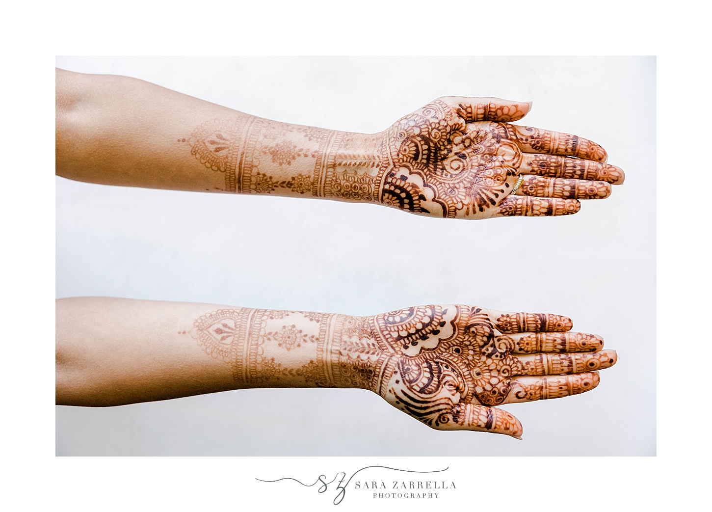bride's henna tattoo on arm for traditional Indian wedding