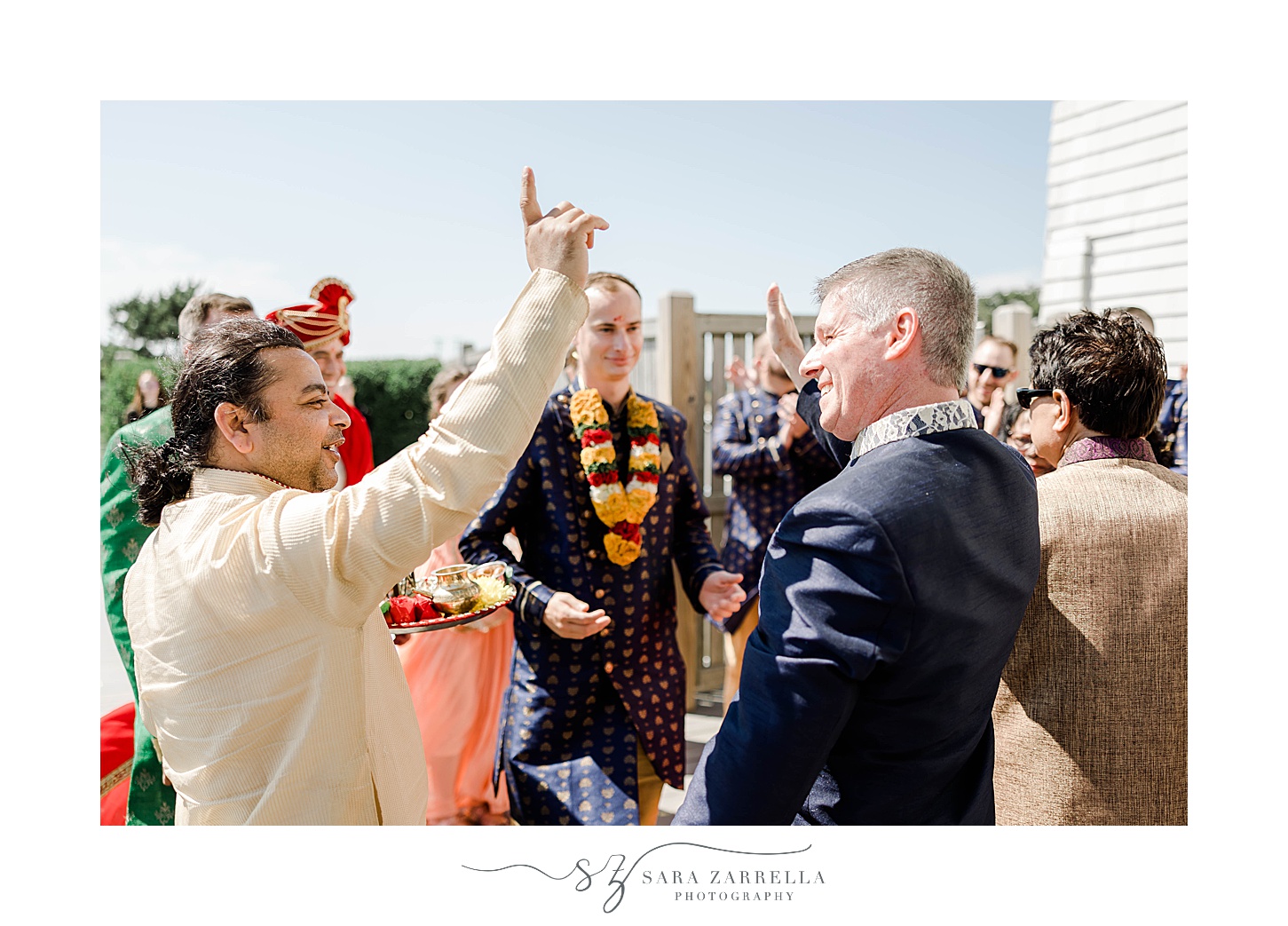 family greets in laws during traditional Indian wedding ceremony at Newport Beach House