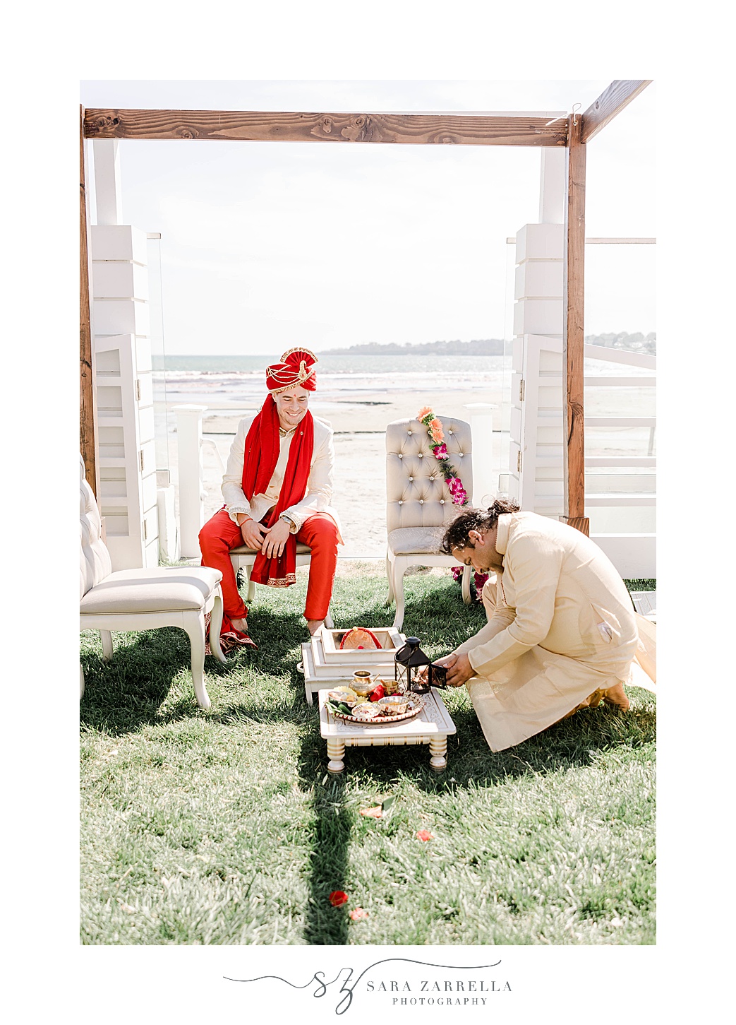 groom sits before traditional Indian wedding ceremony at Newport Beach House