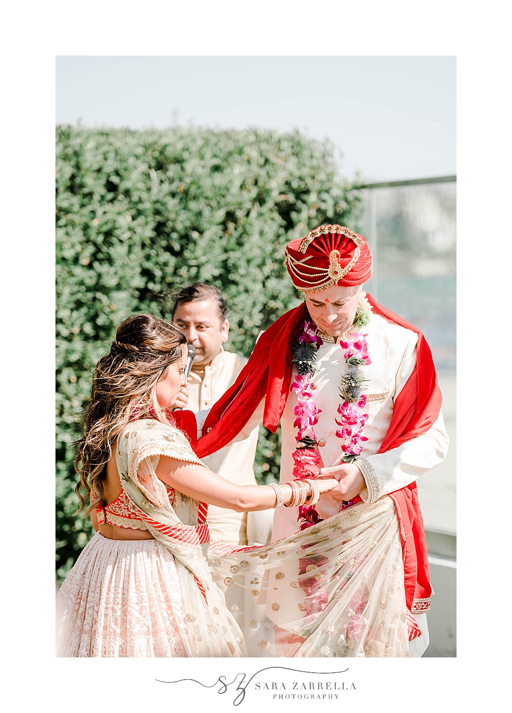 bride and groom walk during traditional Indian wedding ceremony at Newport Beach House