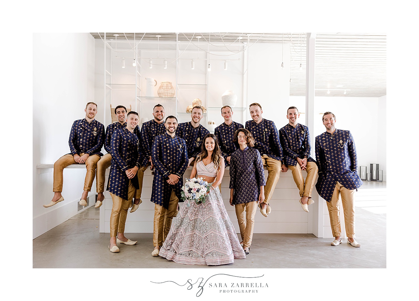 bride poses with groomsmen at Newport Beach House