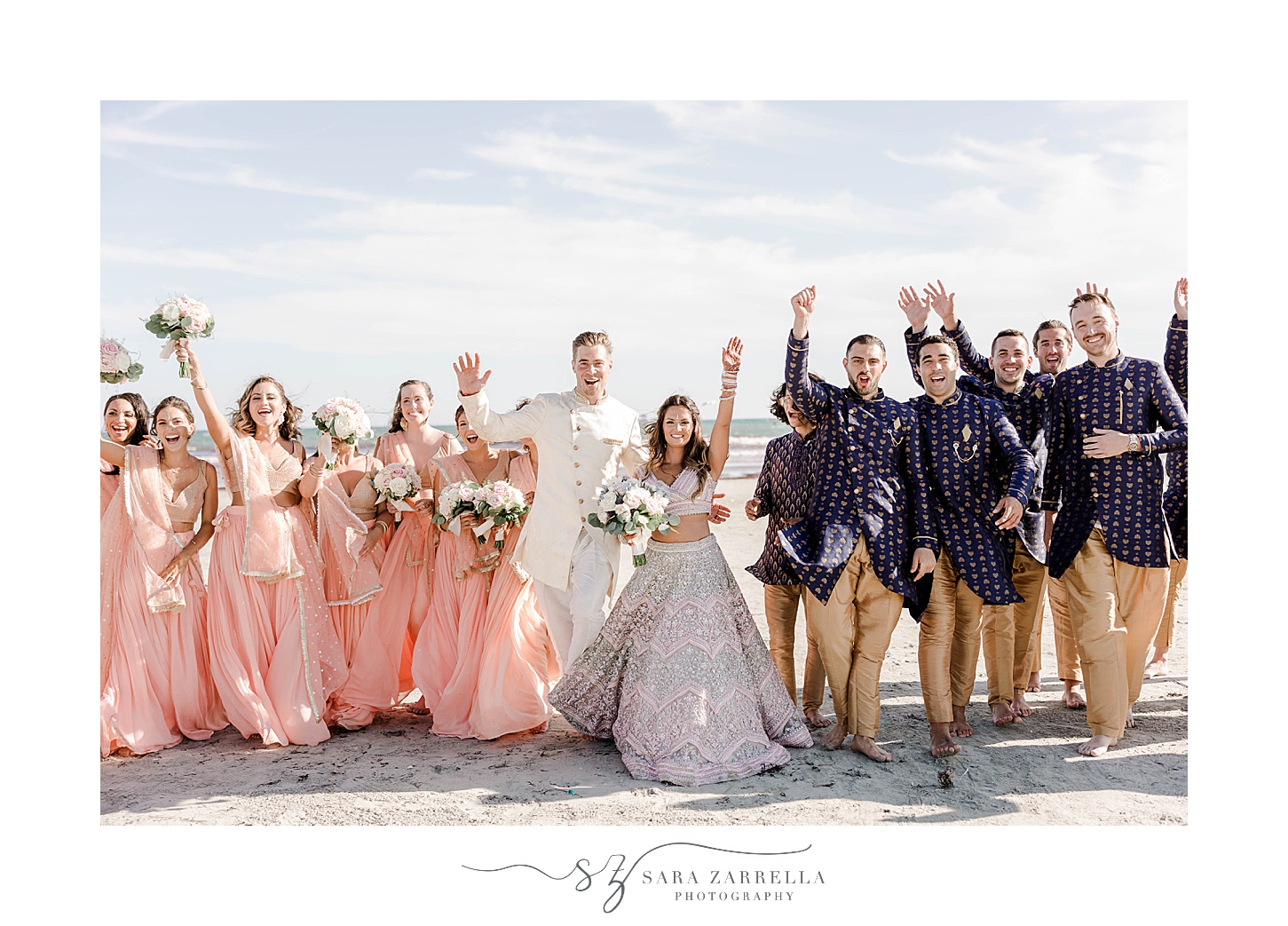 bride and groom stand with wedding party on Newport Beach 