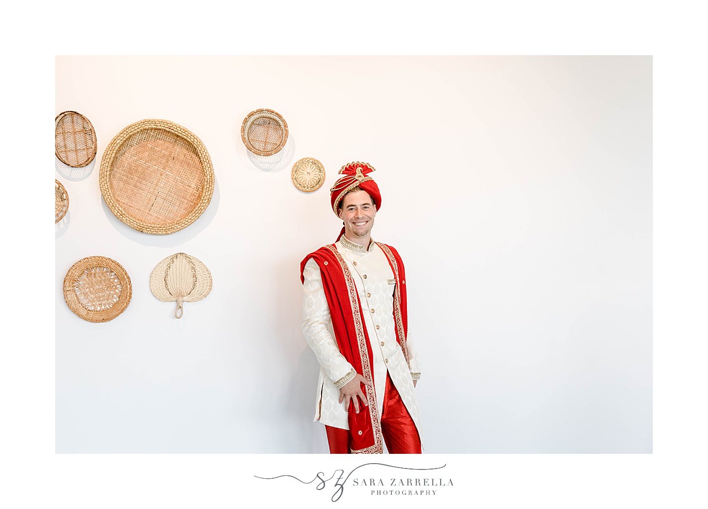groom poses in red turban at Newport Beach House