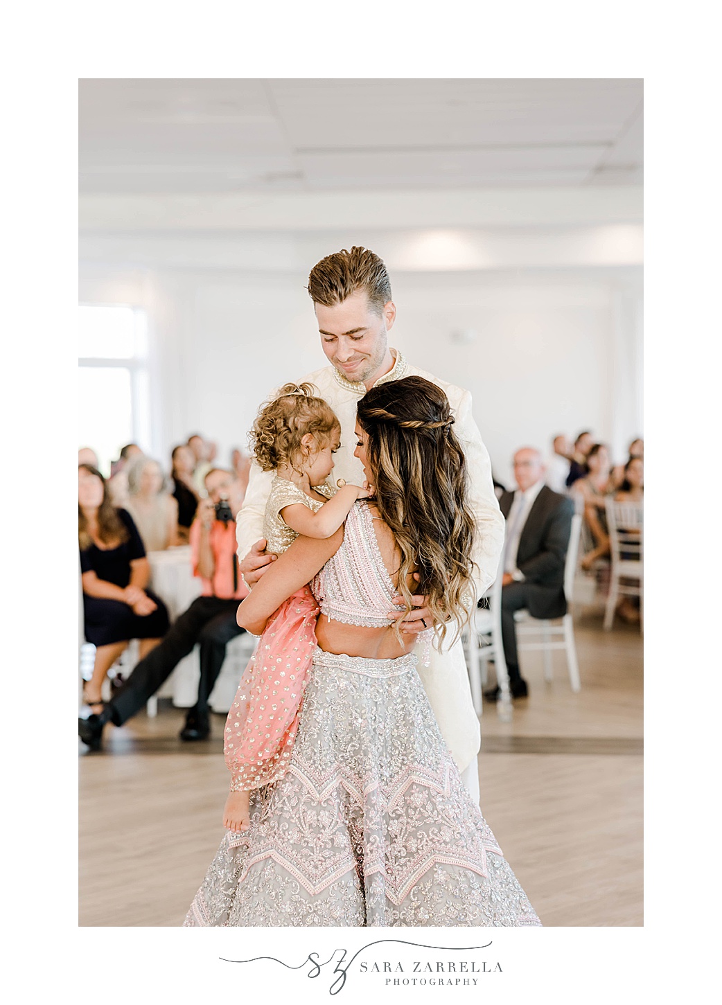 newlyweds dance with daughter during first dance at Newport Beach House