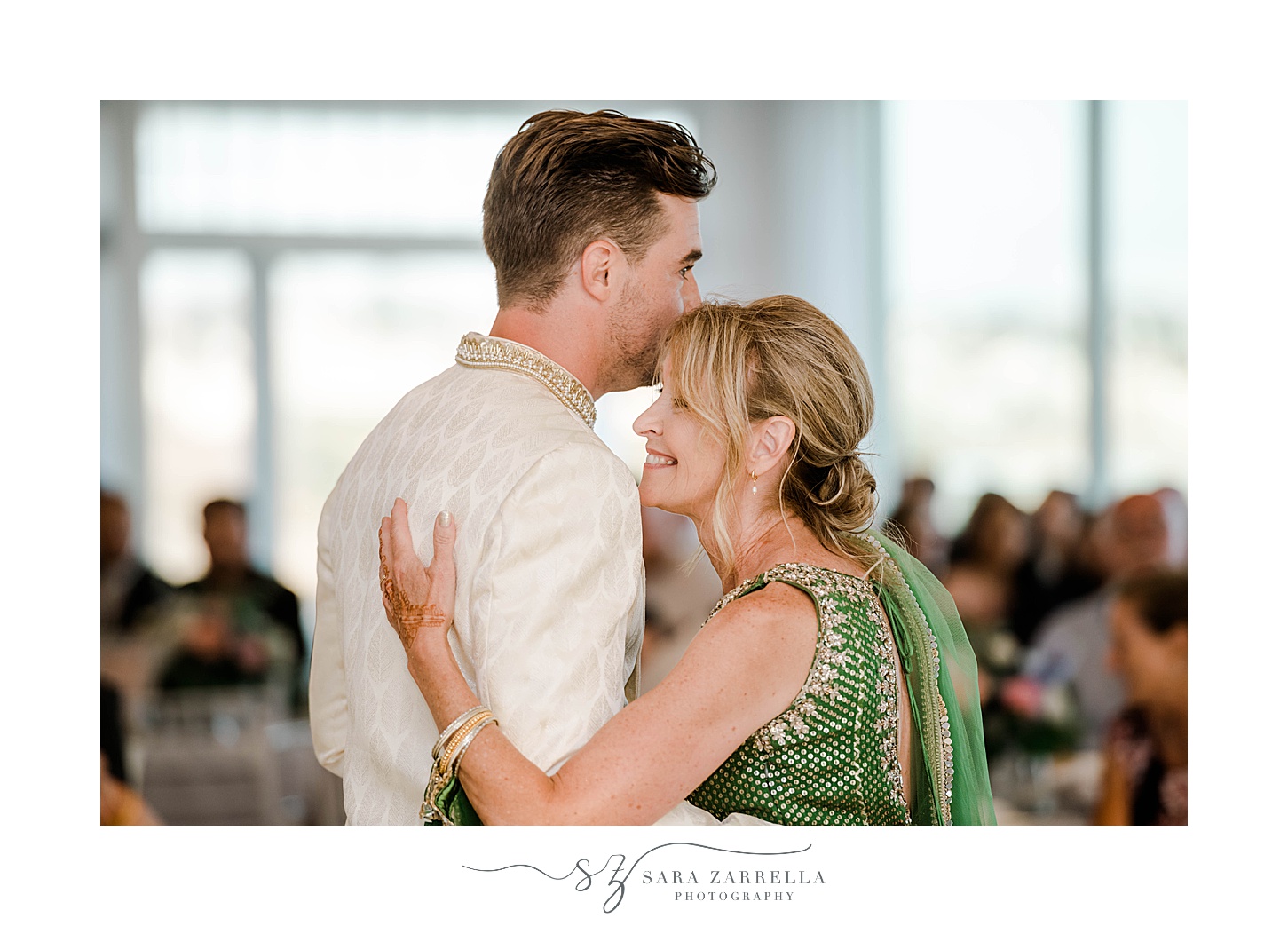 groom dances with mother in green saree at Newport Beach House