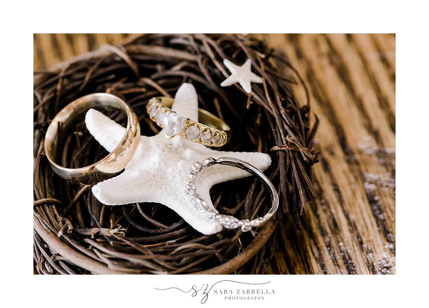 wedding rings lay on white starfish 