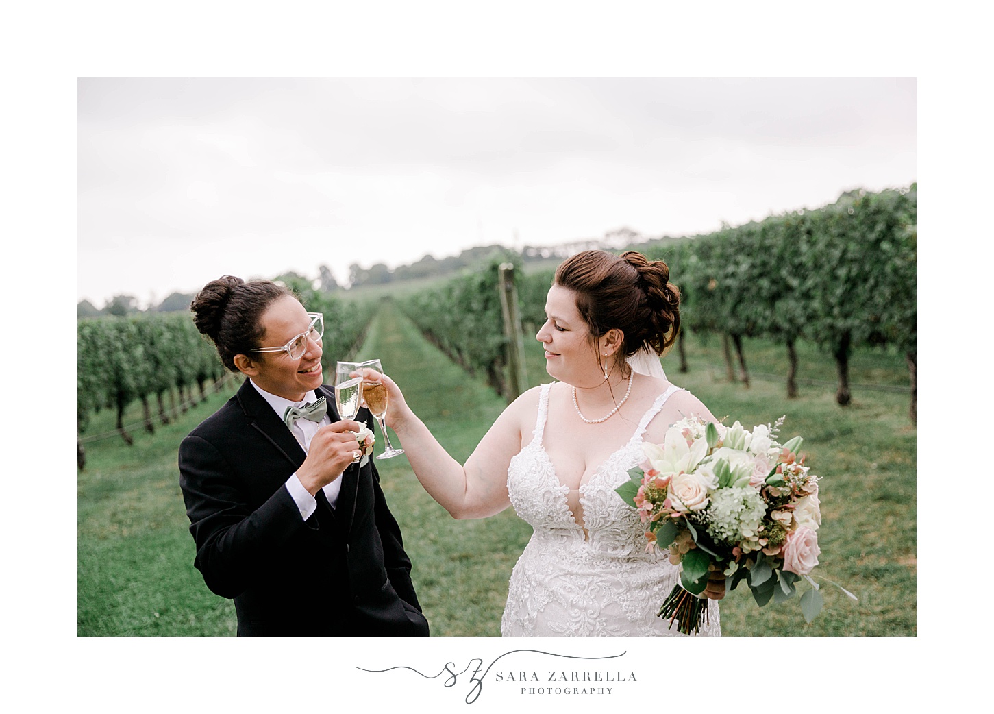 newlyweds toast with champagne after ceremony