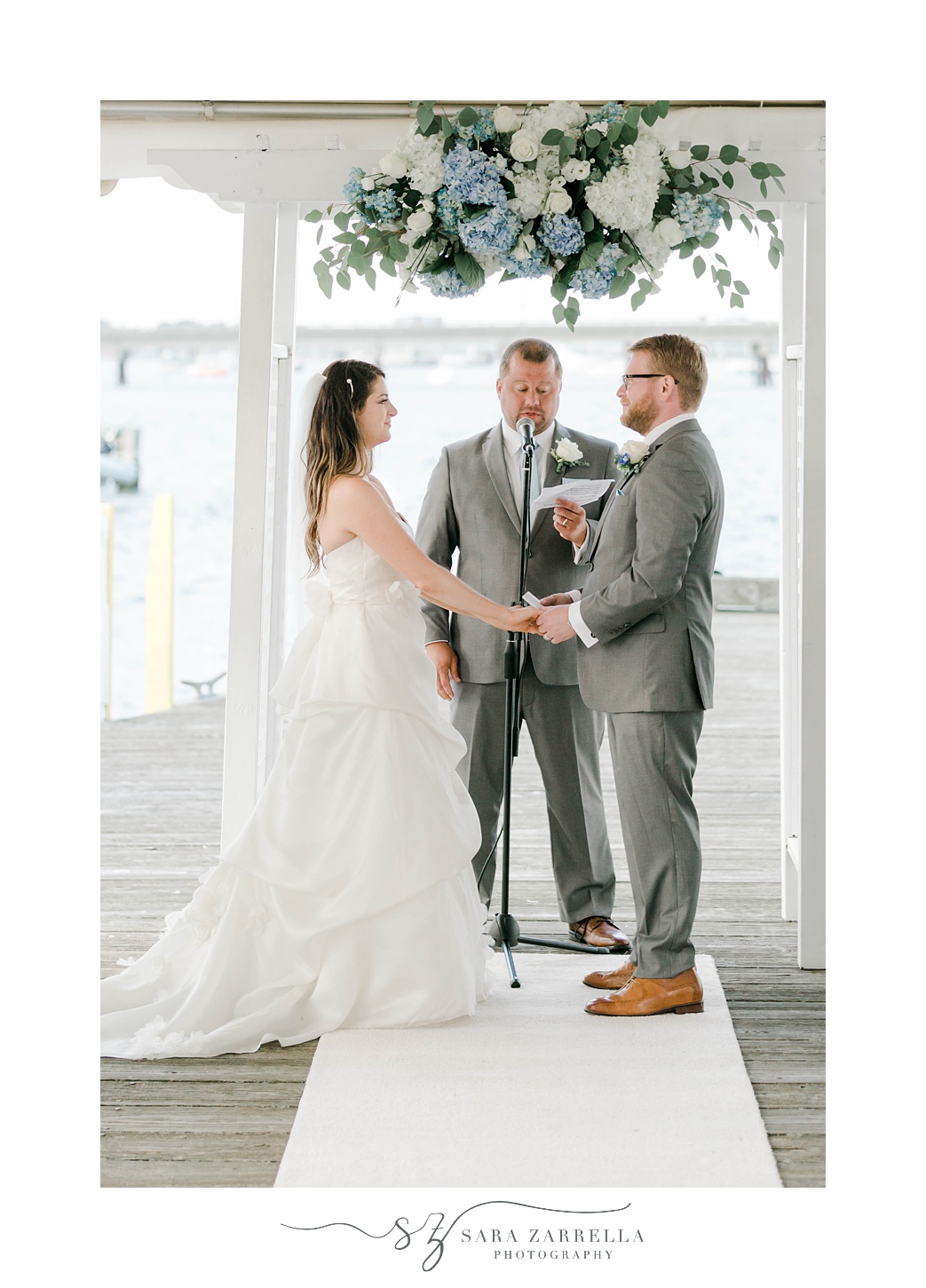 couple exchanges vows during Regatta Place wedding ceremony