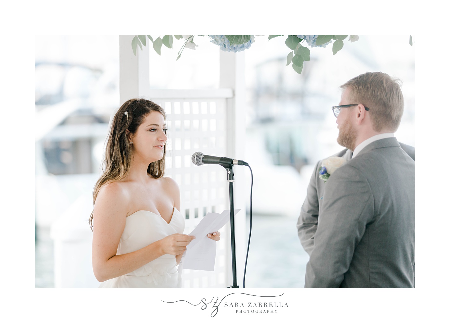 bride reads vows to groom during Regatta Place wedding ceremony