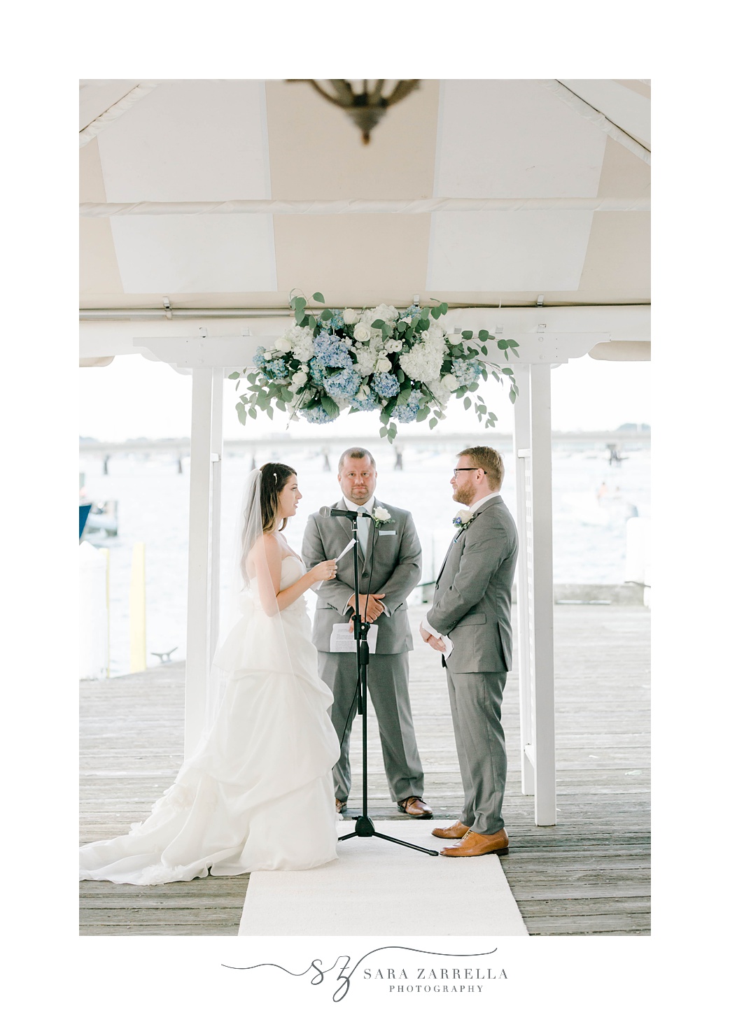 couple exchanges vows during Regatta Place wedding ceremony
