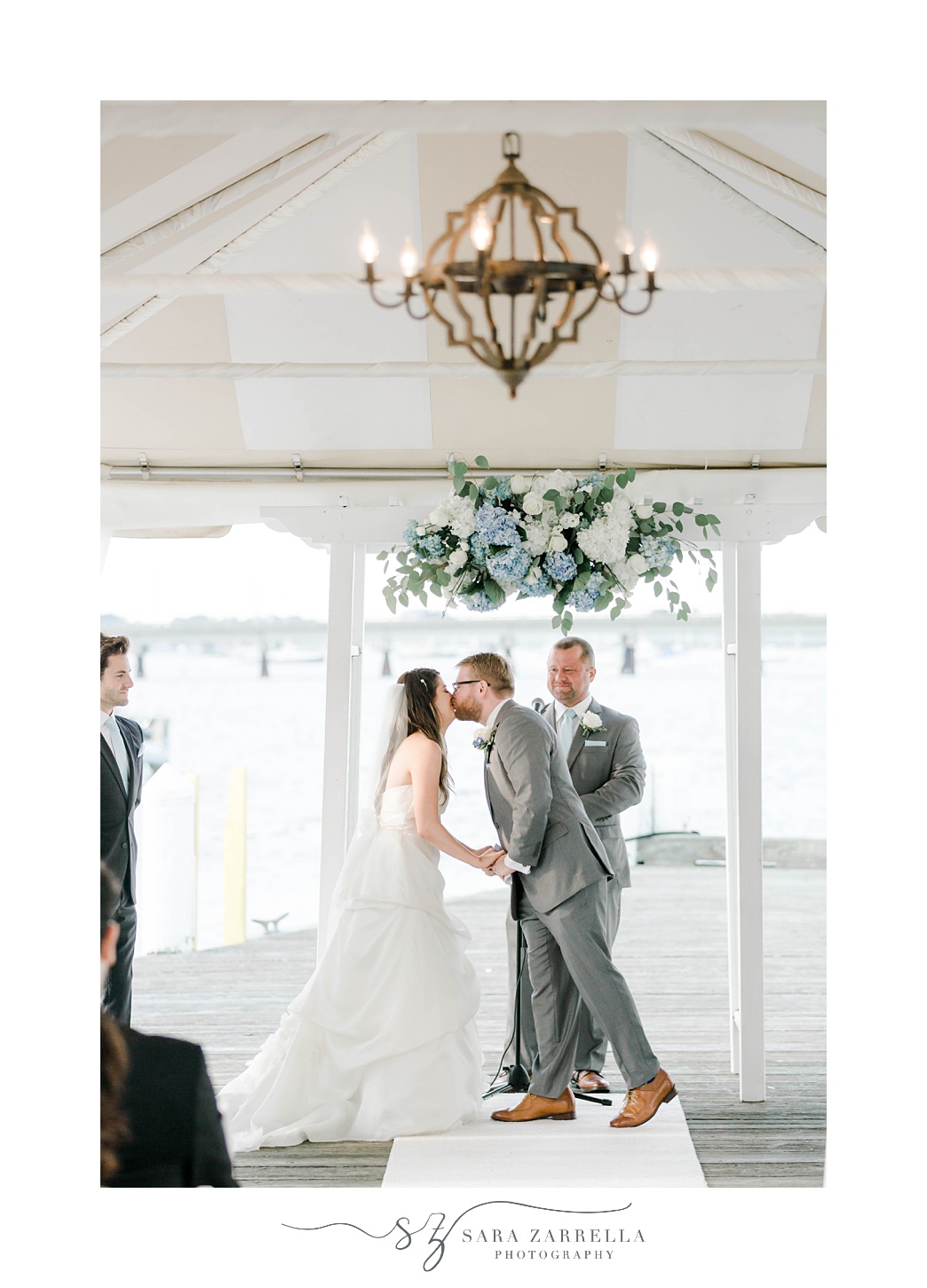bride and groom kiss after Regatta Place wedding ceremony