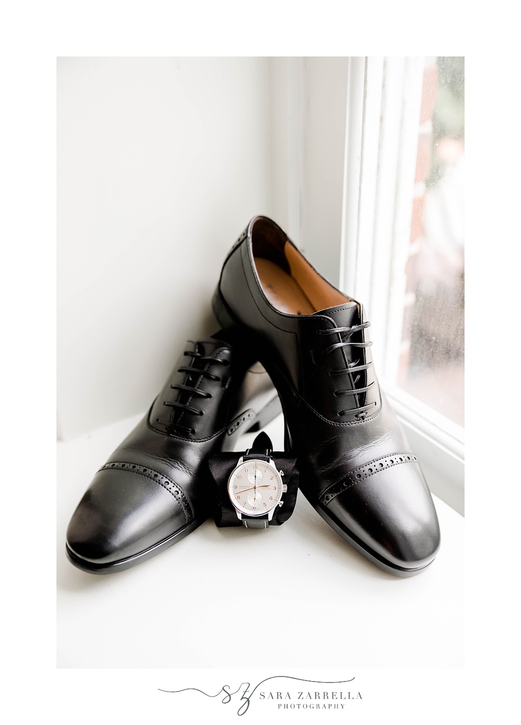 groom's black shoes and cologne for Rosecliff Mansion wedding