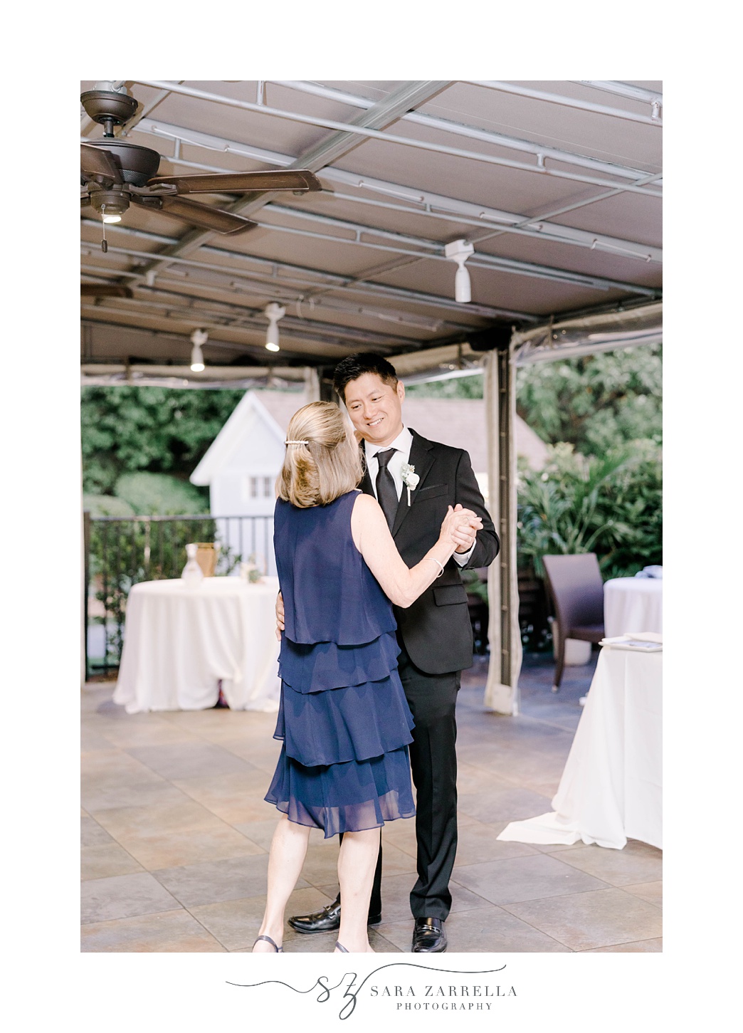 groom dances with mother at The Boat House