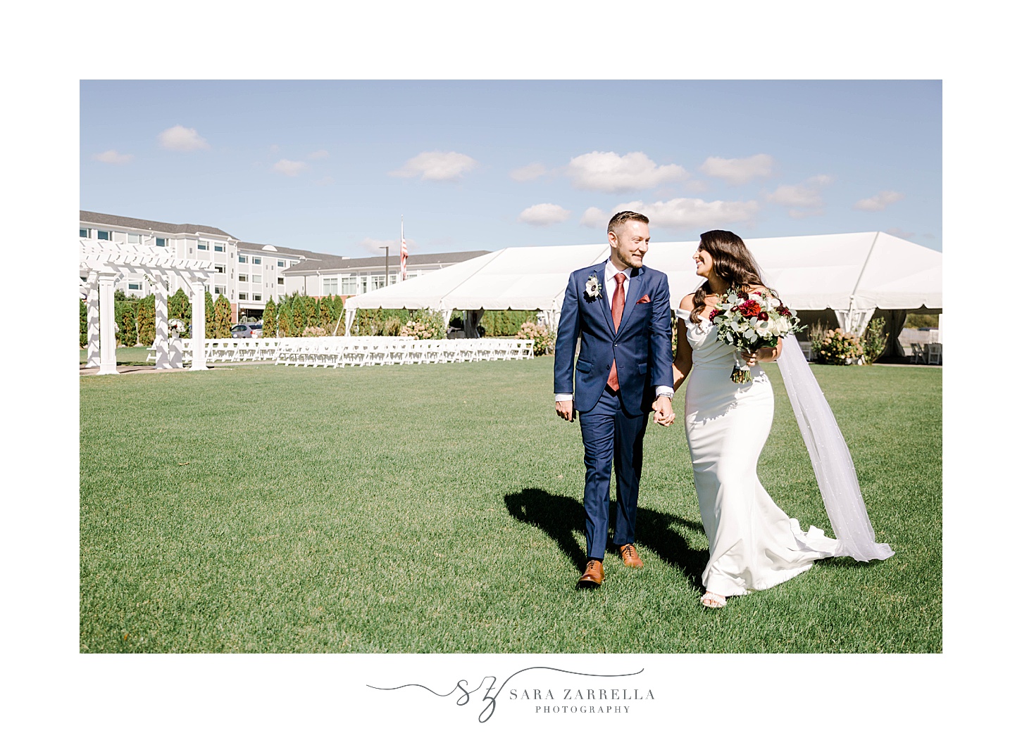 bride and groom walk on lawn at Atlantic Resort Wyndham