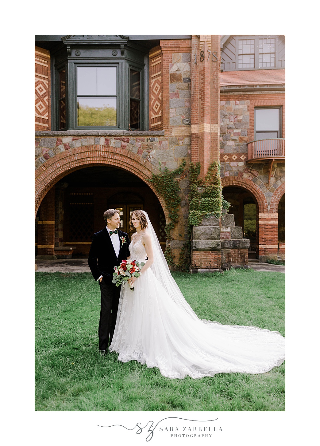 newlyweds stand together on lawn at Eustis Estate