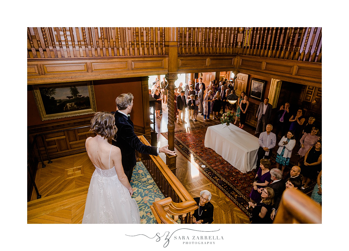 bride and groom greet guests in lobby of Eustis Estate