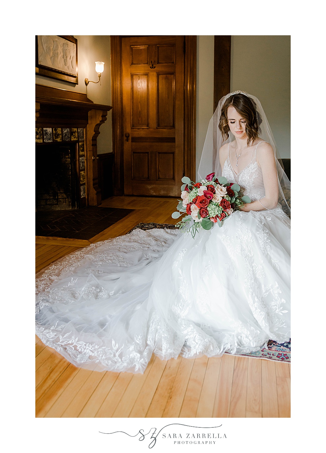 Eustis Estate bridal portraits with veil around her holding pink and red bouquet 