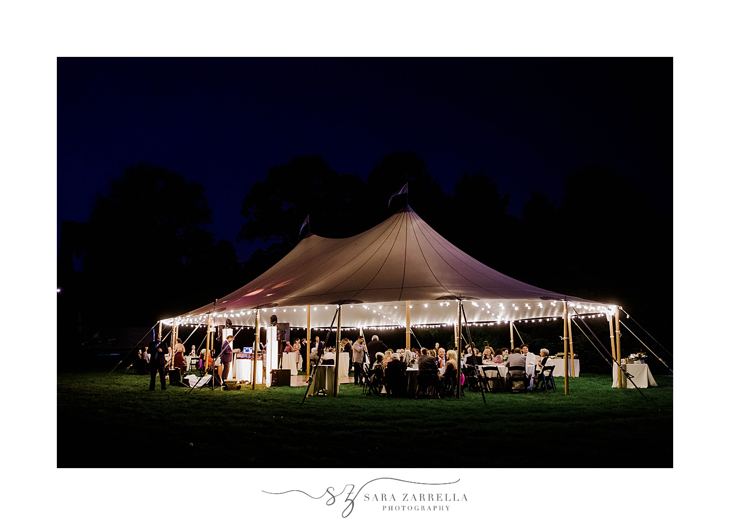 nighttime wedding reception under tent