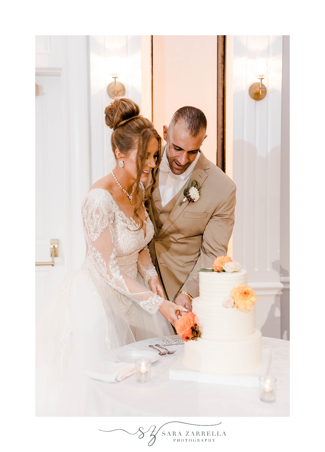 bride and groom cut fall wedding cake