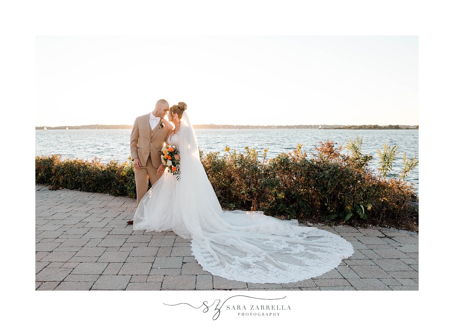 bride and groom lean heads together during Newport Harbor Island Resort wedding portraits