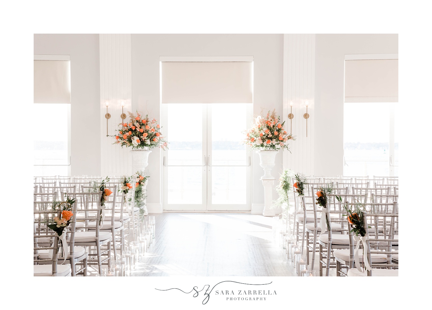 wedding ceremony with orange flower accents at Newport Harbor Island Resort