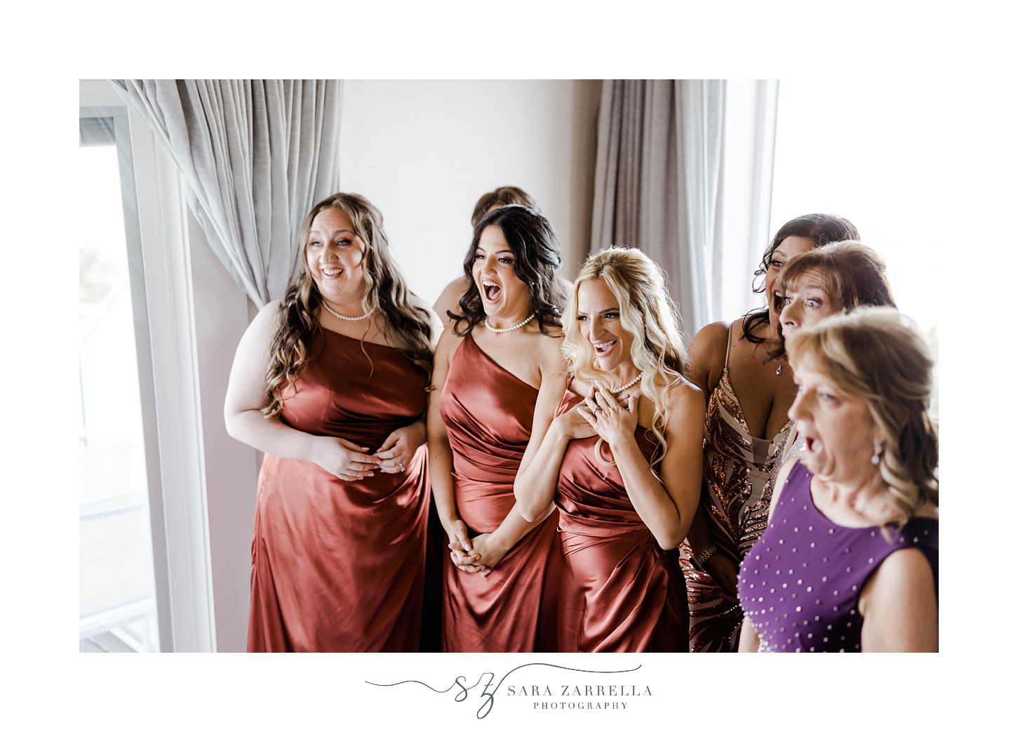 bridesmaids cheer during first look with bride 