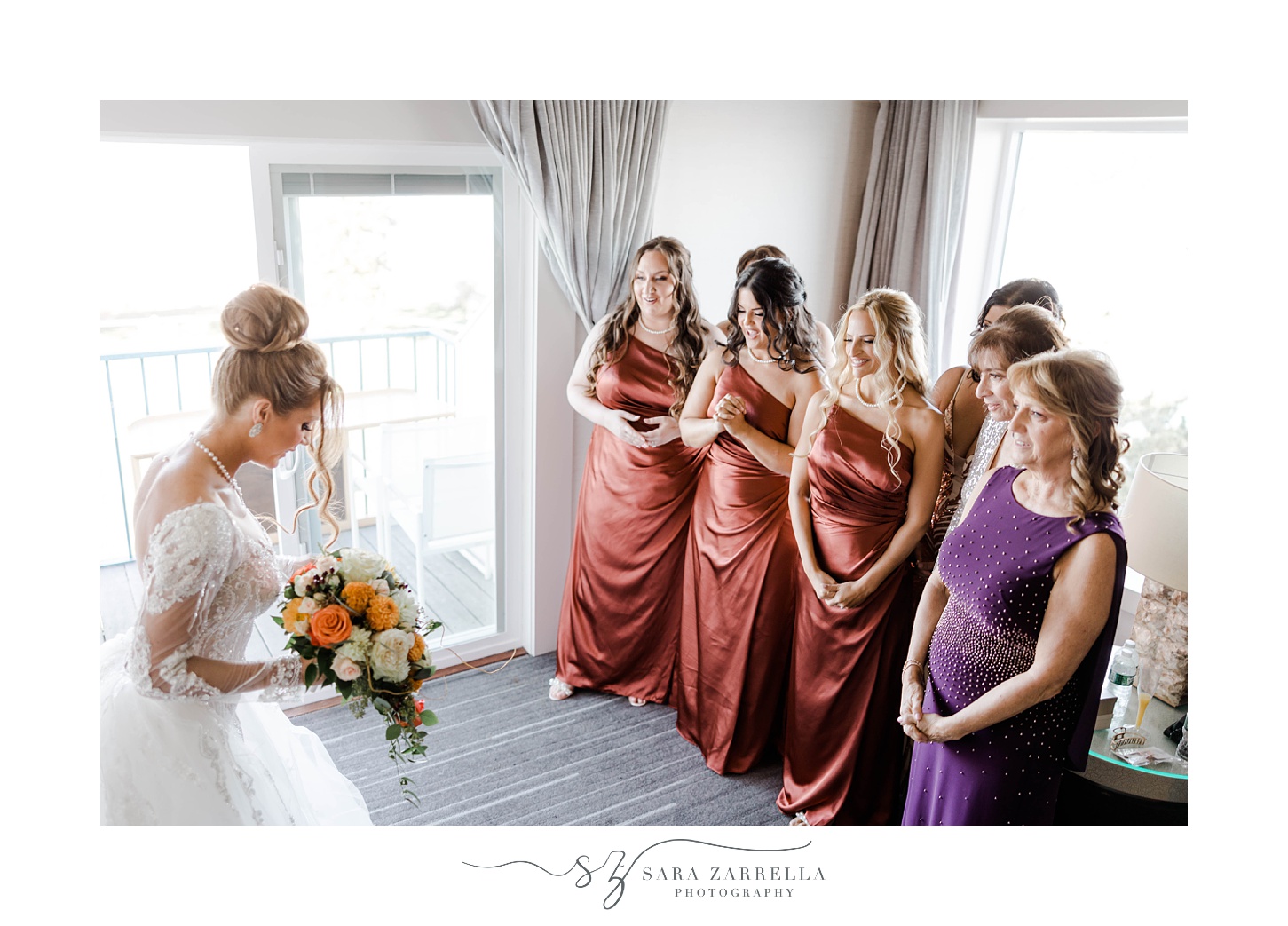 bridesmaids smile and cheer with bride during first look 