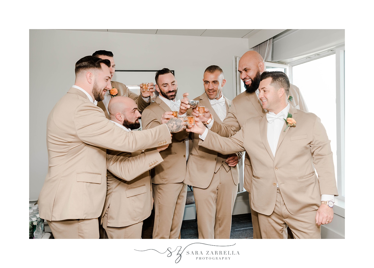 groom and groomsmen toast during wedding day prep 