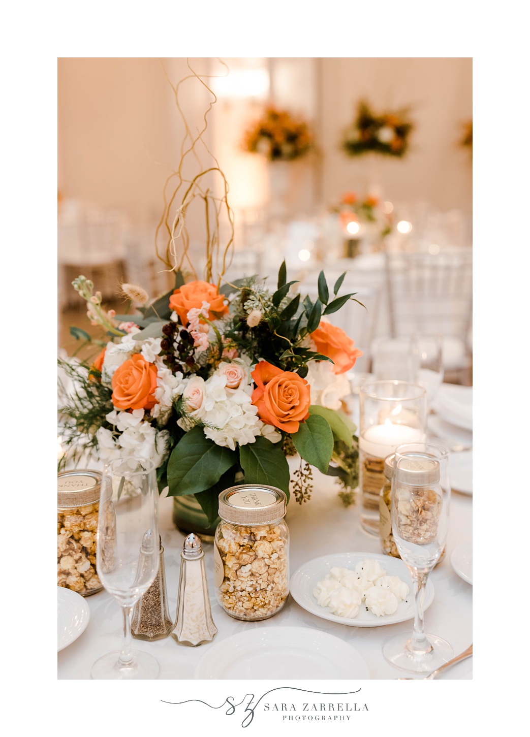 centerpieces with orange and white flowers in Newport RI