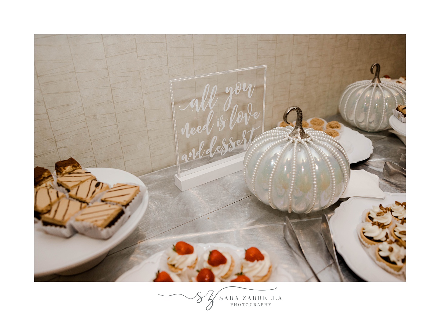 fall wedding day dessert display with silver pumpkins