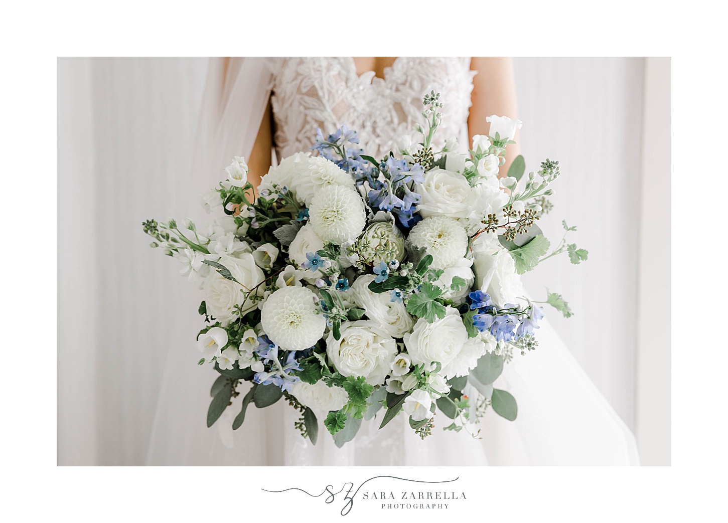 bride holds bouquet of blue and white flowers