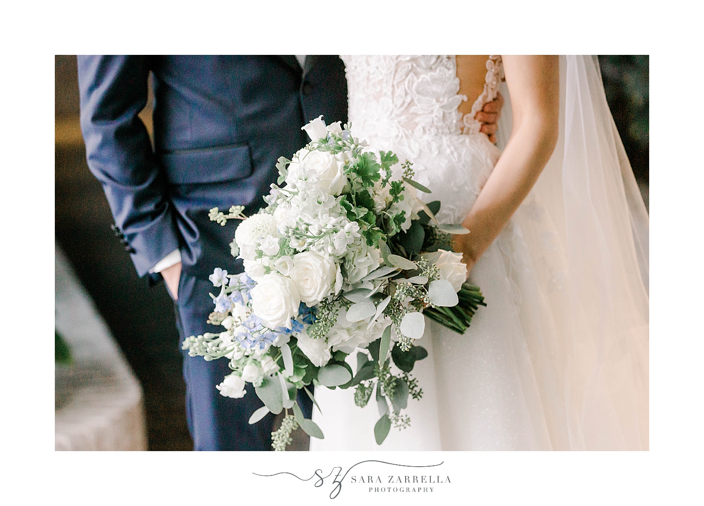 bride and groom stand together in lobby of Newport Harbor Island Resort