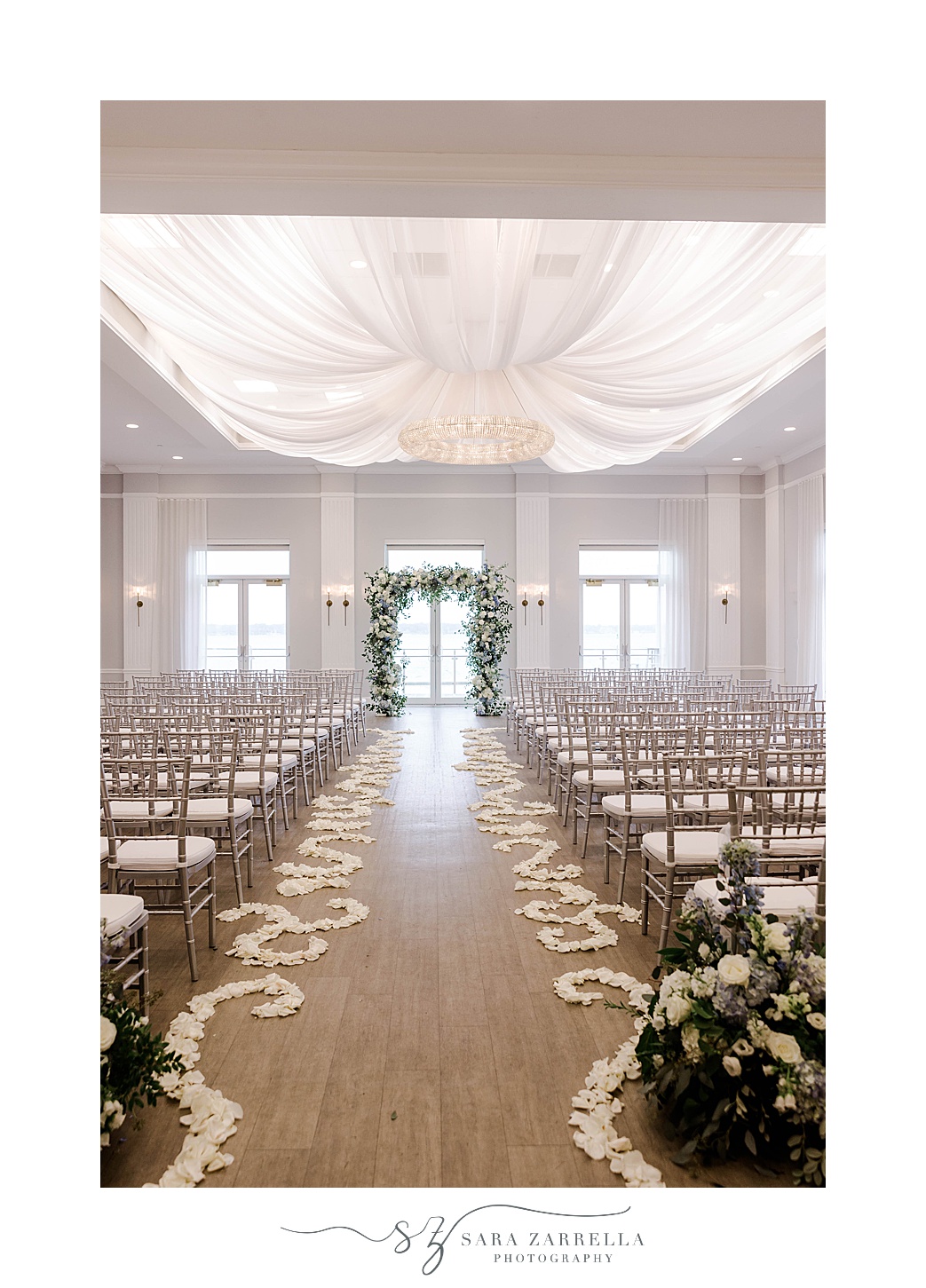 Newport Harbor Island Resort wedding ceremony with floral petals along aisle 