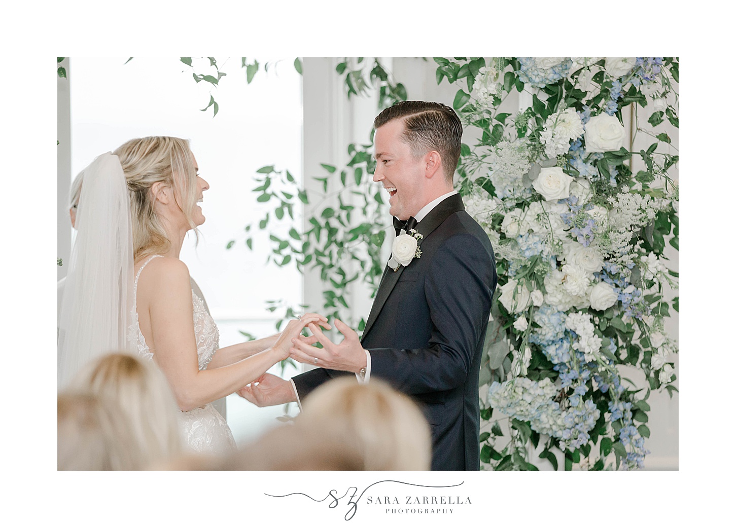 bride and groom laugh together during wedding ceremony at Newport Harbor Island Resort