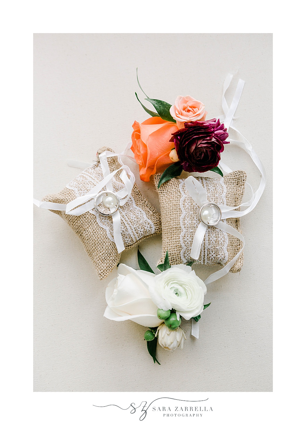 rings and boutonnières for grooms at Rosecliff Mansion wedding