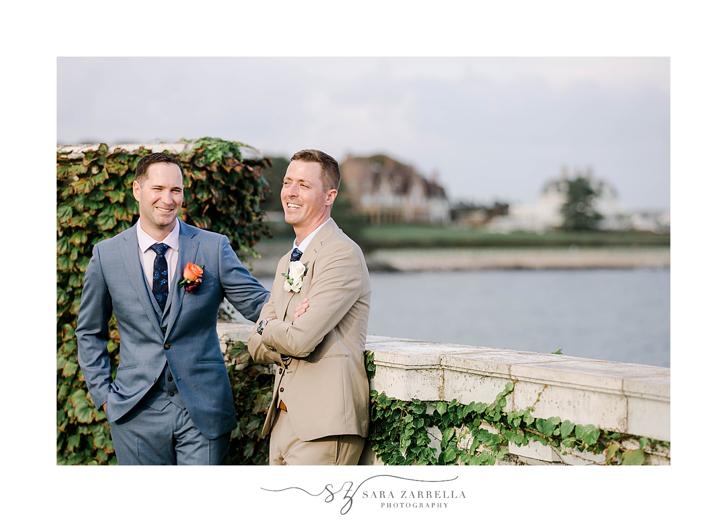 grooms laugh together during Newport RI wedding photos