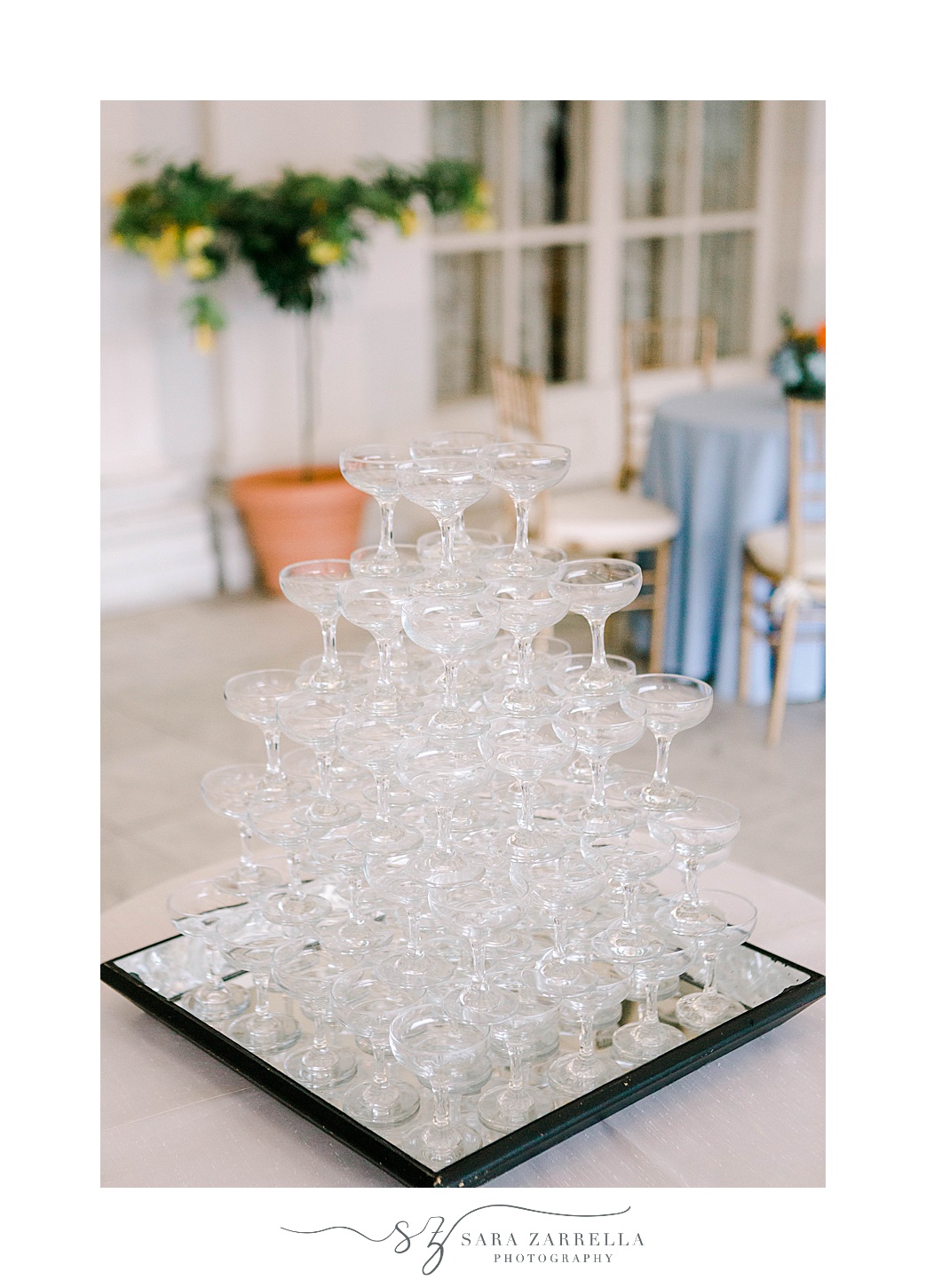 champagne glasses stacked in tower