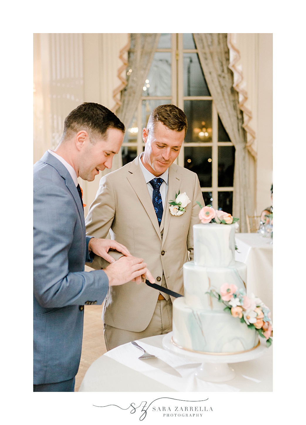 grooms cut wedding cake during Newport RI wedding reception