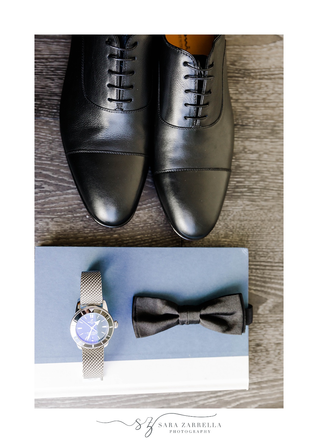 groom's classic black shoes, tie and watch for Belle Mer wedding