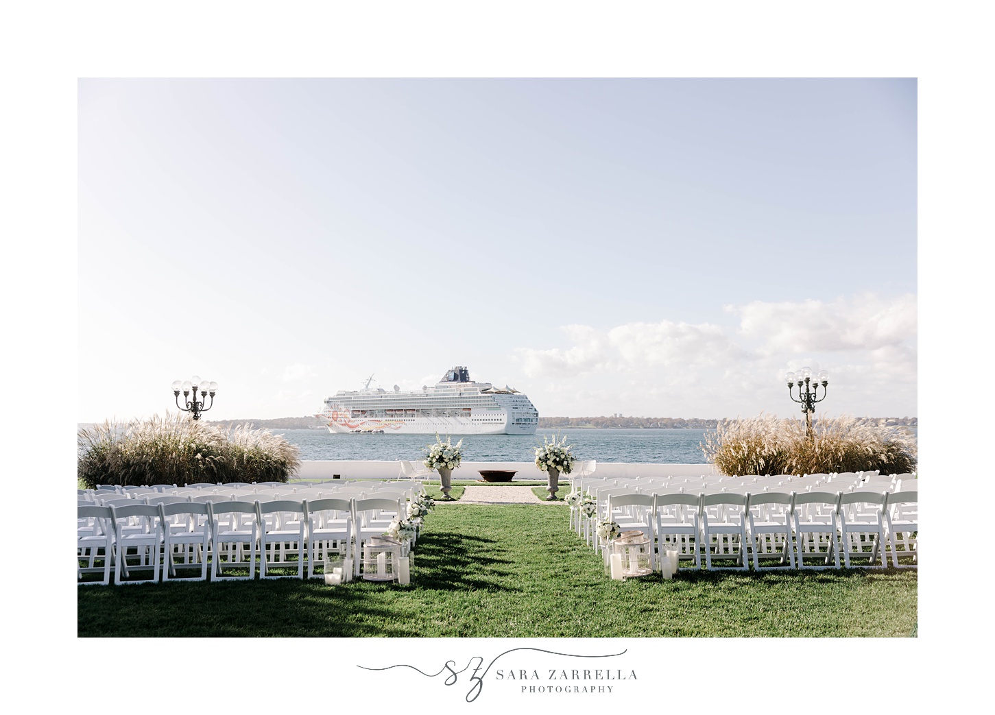 wedding ceremony site on lawn at Belle Mer with cruise ship passing by 