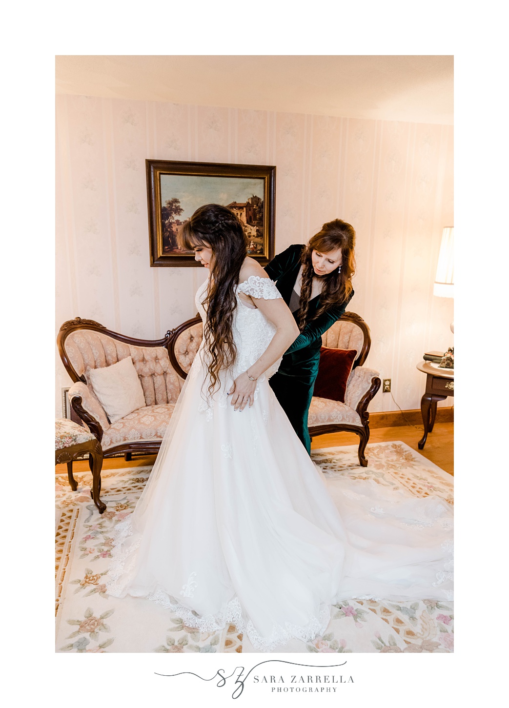 bride and sister prepare for wedding day 