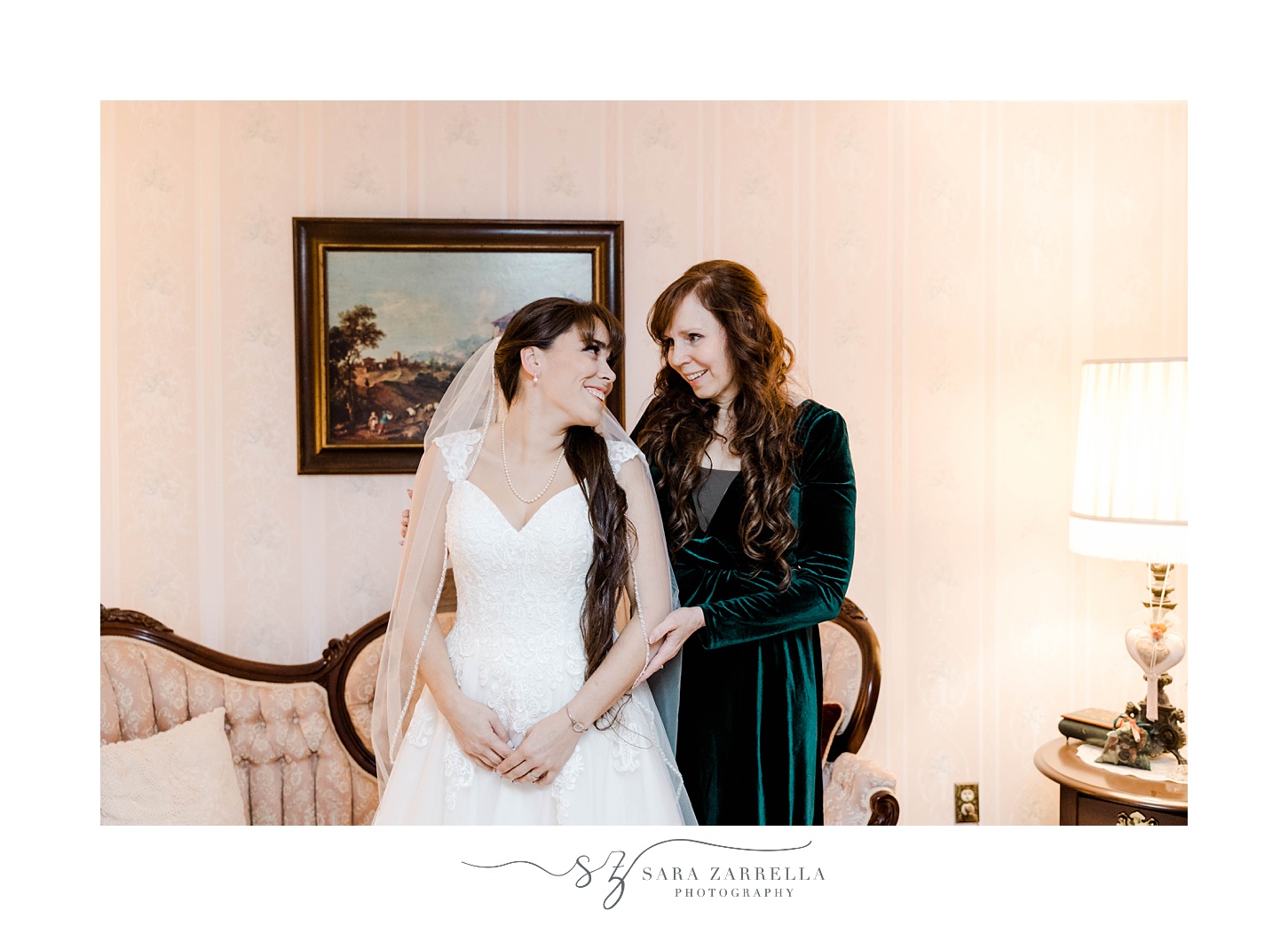 bride smiles at mother during prep at Foster Country Club