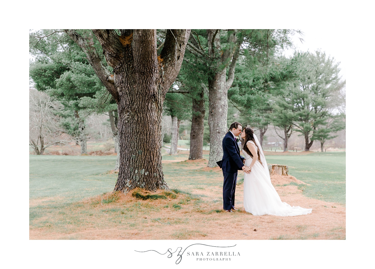 bride and groom kiss on edge of woods at Foster Country Club