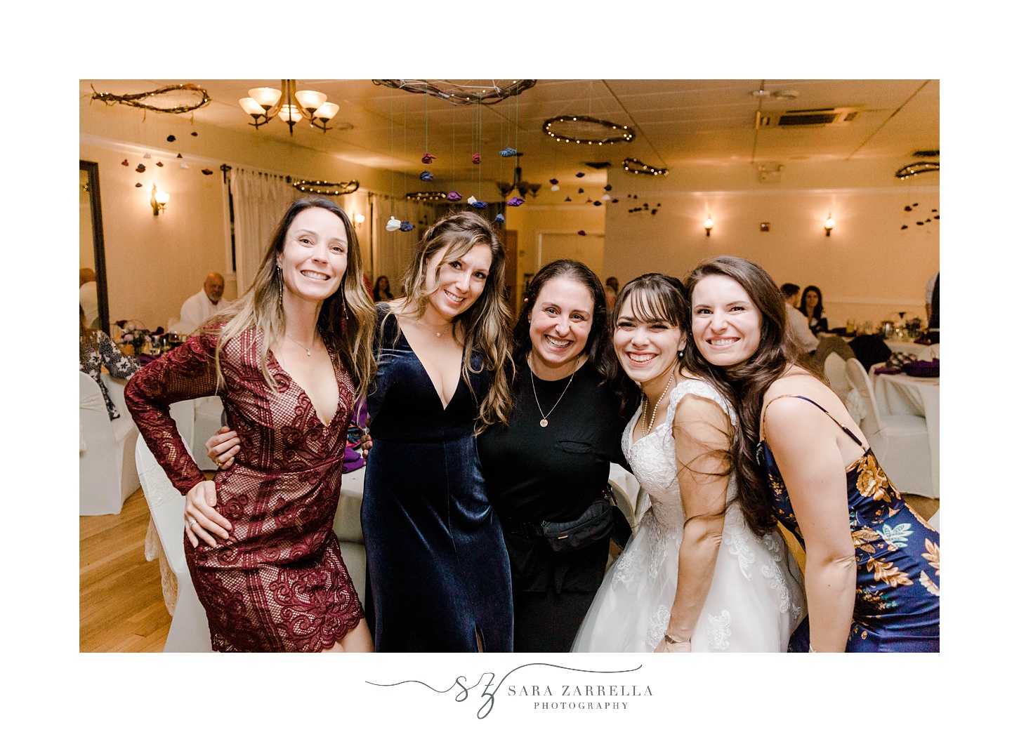 Rhode Island wedding photographer Sara Zarrella Photography poses with bride and three other SZP brides 