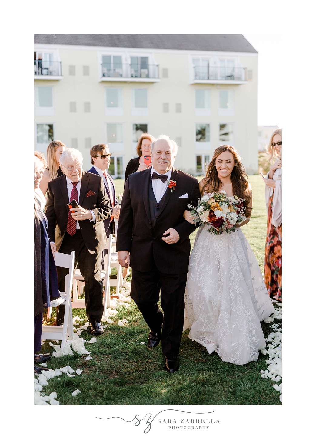 bride and father walk down aisle for fall wedding ceremony at Newport Harbor Island Resort